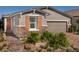Charming single-Gathering home with brick accents, manicured landscaping, and a two-car garage at 3434 Oristano Ln, Henderson, NV 89044