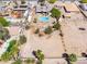 Bird's-eye view of a property with a backyard pool, vacant land, and neighboring houses at 3845 S Torrey Pines Dr, Las Vegas, NV 89103