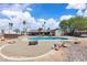 The backyard has a pristine pool, mature trees, a grill, and a camping trailer at 3845 S Torrey Pines Dr, Las Vegas, NV 89103