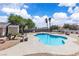 Backyard featuring a refreshing pool with landscaping, creating a perfect outdoor oasis for relaxation and entertainment at 3845 S Torrey Pines Dr, Las Vegas, NV 89103