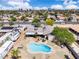Aerial view showcases a kidney-shaped pool, outdoor seating, and desert-style backyard in a home at 3845 S Torrey Pines Dr, Las Vegas, NV 89103
