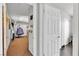 Hallway featuring hardwood floors and providing access to a bedroom with a unique hanging chair at 3845 S Torrey Pines Dr, Las Vegas, NV 89103