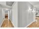Bright hallway featuring hardwood floors, modern lighting, and neutral paint, creating a welcoming, spacious feel at 3845 S Torrey Pines Dr, Las Vegas, NV 89103