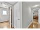 Hallway with hardwood floors, access to bathroom, and bedroom contributing to a functional and modern layout at 3845 S Torrey Pines Dr, Las Vegas, NV 89103