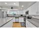 Bright and modern kitchen with stainless steel appliances and gray countertops at 3845 S Torrey Pines Dr, Las Vegas, NV 89103