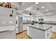 Bright kitchen with white cabinets, stainless appliances, and a functional island at 3845 S Torrey Pines Dr, Las Vegas, NV 89103