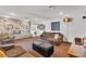 Cozy living room with stone fireplace, comfortable seating, and views to other parts of the house at 3845 S Torrey Pines Dr, Las Vegas, NV 89103
