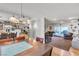 Open living room and dining room with wood and carpet flooring at 3845 S Torrey Pines Dr, Las Vegas, NV 89103