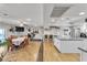 Open living space boasting a dining area, exercise equipment, and bright, modern kitchen at 3845 S Torrey Pines Dr, Las Vegas, NV 89103