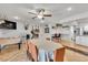 Open concept living area featuring a foosball table, dining space, and a kitchen with bar seating at 3845 S Torrey Pines Dr, Las Vegas, NV 89103