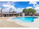 A beautiful pool with chairs, a shed, and a lounging area with blue skies in the background at 3845 S Torrey Pines Dr, Las Vegas, NV 89103