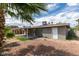 Backyard showing minimal landscaping, patio cover and access doors to the house at 4393 Swandale Ave, Las Vegas, NV 89121