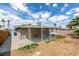 Backyard patio with large metal awning at 4393 Swandale Ave, Las Vegas, NV 89121
