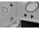 Modern bathroom featuring white marble tile, contemporary fixtures, and a stylish vanity at 4393 Swandale Ave, Las Vegas, NV 89121