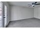 Bright bedroom features a ceiling fan, closet and access to a patio with glass doors at 4393 Swandale Ave, Las Vegas, NV 89121