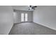 Spacious carpeted bedroom with access to the backyard through double glass doors at 4393 Swandale Ave, Las Vegas, NV 89121