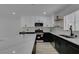 Modern kitchen features an island with a white countertop and stainless steel appliances at 4393 Swandale Ave, Las Vegas, NV 89121