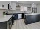 Modern kitchen featuring stainless appliances, white cabinets, and a large island at 4393 Swandale Ave, Las Vegas, NV 89121