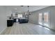 Modern kitchen with stainless steel appliances, dark cabinetry, and a view to the backyard at 4393 Swandale Ave, Las Vegas, NV 89121