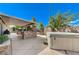Spacious backyard with covered patio, built-in grill, bar area and relaxing hot tub at 444 Flores Cir, Las Vegas, NV 89123