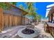 Backyard featuring a firepit and landscaped yard at 444 Flores Cir, Las Vegas, NV 89123