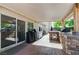 Covered patio featuring a built-in grill, bar area, and sliding glass door at 444 Flores Cir, Las Vegas, NV 89123
