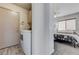 Bedroom includes a washer/dryer and a ceiling fan with attached light at 444 Flores Cir, Las Vegas, NV 89123