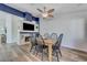 Bright dining area features a wooden table and six chairs, bathed in natural light at 444 Flores Cir, Las Vegas, NV 89123