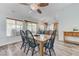 Cozy dining room with hardwood floors, a dining table with seating for six, and natural light at 444 Flores Cir, Las Vegas, NV 89123