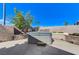 Backyard with a built-in hot tub and well-manicured landscaping at 444 Flores Cir, Las Vegas, NV 89123