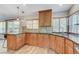 Bright kitchen with granite countertops, wood cabinets, and stainless steel sink at 444 Flores Cir, Las Vegas, NV 89123