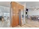 Spacious kitchen flows into dining area, featuring stainless steel appliances and wood cabinetry at 444 Flores Cir, Las Vegas, NV 89123