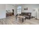 Bright living room with hardwood floors, large window, and modern decor and plenty of natural light at 444 Flores Cir, Las Vegas, NV 89123