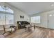 Bright living room with hardwood floors, a large window, and modern decor and plenty of natural light at 444 Flores Cir, Las Vegas, NV 89123