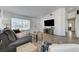 Comfortable living room featuring hardwood floors, lots of natural light, and a cozy seating area at 444 Flores Cir, Las Vegas, NV 89123