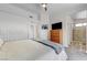 Bright main bedroom features a TV, large closet, ceiling fan, and attached bath at 444 Flores Cir, Las Vegas, NV 89123