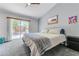 Charming bedroom with a sliding glass door leading to a well designed backyard at 444 Flores Cir, Las Vegas, NV 89123