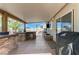 A view of the outdoor kitchen with a stainless steel refrigerator and overhead patio at 444 Flores Cir, Las Vegas, NV 89123