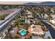 A picturesque aerial view of the neighborhood and a two-story home with desert landscaping at 4471 Borrego Springs Way, Las Vegas, NV 89129