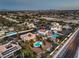A wide aerial view captures a community with multiple homes, desert landscaping, and swimming pools at 4471 Borrego Springs Way, Las Vegas, NV 89129
