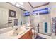 Bright bathroom with glass shower, single sink vanity, and coordinating decor at 4471 Borrego Springs Way, Las Vegas, NV 89129