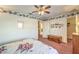 Bedroom with floral bedding, light walls and trim, and natural light at 4471 Borrego Springs Way, Las Vegas, NV 89129