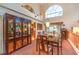 Dining area with natural light, a china cabinet and adjacent living area at 4471 Borrego Springs Way, Las Vegas, NV 89129