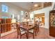 Dining area with natural light, staircase and adjacent living area at 4471 Borrego Springs Way, Las Vegas, NV 89129
