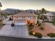 Stunning two-story home showcasing a spacious three-car garage, landscaped yard, and mountain views at 4471 Borrego Springs Way, Las Vegas, NV 89129