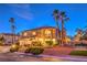 Charming two-story home with well-manicured landscaping, mature palm trees, and a circular driveway at 4471 Borrego Springs Way, Las Vegas, NV 89129