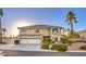 Charming two-story home with well-manicured landscaping, mature palm trees, and a three-car garage at 4471 Borrego Springs Way, Las Vegas, NV 89129
