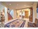 Spacious foyer with tile flooring, a staircase leading to the second floor, and elegant decor at 4471 Borrego Springs Way, Las Vegas, NV 89129