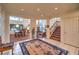 Open foyer with tile flooring, stairs to the second floor, and a view into the dining and living areas at 4471 Borrego Springs Way, Las Vegas, NV 89129