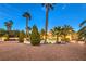 Stunning property with mature landscaping, tall palms and a circular drive create a grand entrance at 4471 Borrego Springs Way, Las Vegas, NV 89129